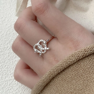 Minimalist S925 sterling silver pretzel knot braided open ring worn on a woman's finger