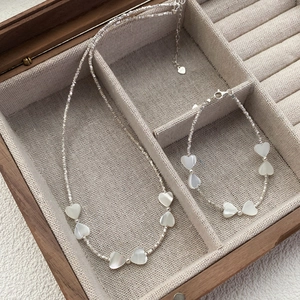 Parure élégante en argent sterling S925 avec nœud et pendentifs cœur en nacre blanche