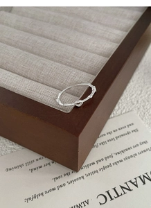 Macro detail of S925 sterling silver heart ring with fine texture and S925 hallmark