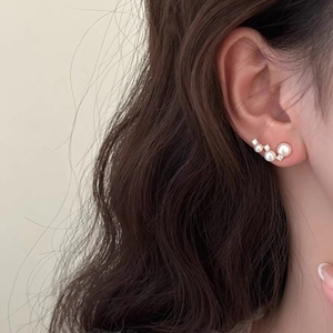 Elegant S925 silver pearl ear climbers with sparkling cubic zirconia on model ear