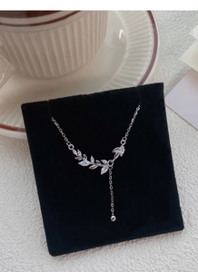 Detail of S999 sterling silver wheat ear necklace with marquise zircon leaves