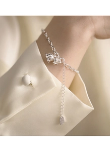 Detailed close-up of S925 sterling silver lily of the valley flower pendant bracelet