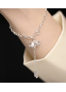 Close-up of S925 silver bracelet featuring lily of the valley bells and Lucky charm
