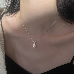 Elegant S925 sterling silver necklace with teardrop pearl pendant on a model neck