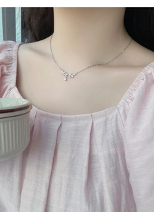Close-up of S999 sterling silver wheat ear necklace with leaves and teardrop pendant