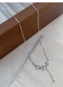 Detailed close-up of S999 sterling silver wheat ear necklace with sparkling zircon stones
