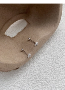 Macro detail of S999 silver clover stud earrings with secure screw back closure