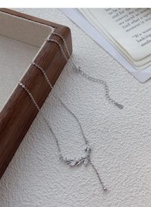 Detail of S999 sterling silver wheat ear necklace with sparkling white zircons
