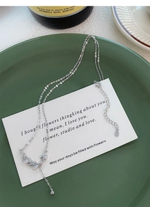 Close-up of S999 silver wheat ear necklace with sparkling zircon and S925 hallmark