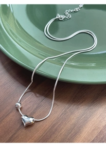 Close-up of S925 sterling silver heart necklace with snake chain and lobster clasp