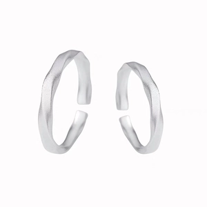 Minimalist S999 silver Mobius rings with matte finish and adjustable open design