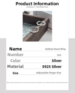 Macro detail of minimalist S925 sterling silver hollow heart ring with adjustable open band