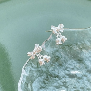 S925 sterling silver lily of the valley bow stud earrings with a matte silver finish