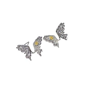 Elegant S925 sterling silver butterfly stud earrings with golden floral filigree details