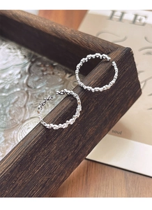 Detailed close-up of S925 sterling silver hollow heart rings with adjustable open band