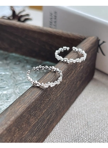 Detail shot of hollow heart pattern on adjustable S925 sterling silver rings