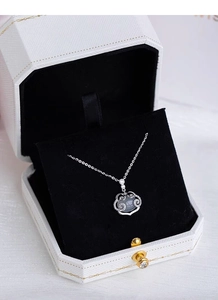 Detailed close-up of S925 silver chalcedony pendant necklace in a velvet gift box