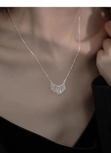 Detailed view of elegant S925 sterling silver tassel pendant necklace on model