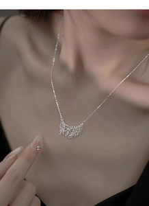 Detail shot of a minimalist S925 silver fringe tassel necklace on a female neck