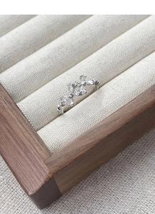 Close-up of S925 sterling silver ring with marquise-cut zircons in floral cluster design