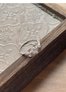 Detail of S925 sterling silver bow ring with sparkling marquise cut cubic zirconia stones