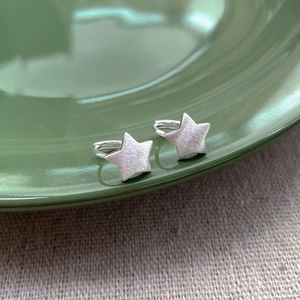 Minimalist S925 sterling silver brushed star hoop earrings with matte metallic texture