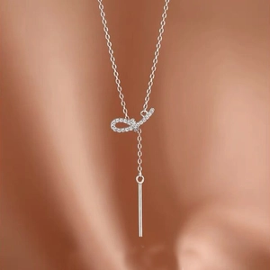 Collier nœud élégant en argent sterling S925 avec pompons en zircon brillant