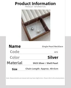 Detail view of S925 sterling silver pearl necklace with gray and white options