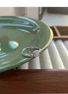 Detailed view of S925 sterling silver adjustable ring with halo square moissanite setting