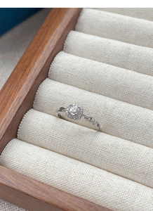 Macro detail of S925 silver ring featuring a square halo diamond and chain link band