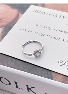 Macro shot of S925 sterling silver square diamond ring with hollow geometric details