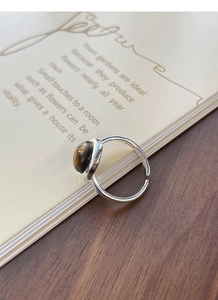 Detail of S925 sterling silver hallmark on adjustable tiger eye stone ring band