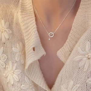 Close-up of S925 silver planet necklace with hollow star pendant on model neck