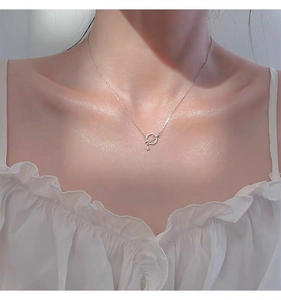 Close-up of S925 silver planet star pendant necklace worn on neck for women