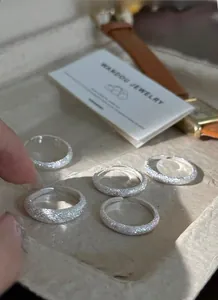 Macro detail of adjustable S925 sterling silver rings with a sparkling frosted texture
