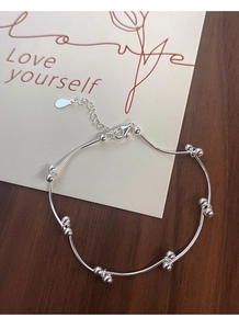 Close-up of S925 sterling silver bead and tube bracelet with adjustable lobster clasp