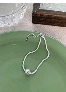 Detailed view of S925 sterling silver beaded bracelet with hallmark on adjustable chain