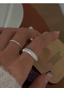 Detail view of adjustable S925 sterling silver frosted and twisted rope rings for couples