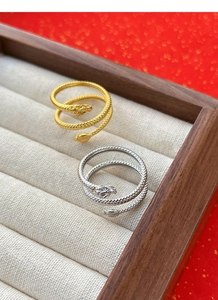 Detail showing gold and silver S925 sterling silver dragon rings with intricate scale textures