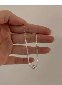 Detail of S925 sterling silver beaded bracelet with cubic zirconia and central sphere