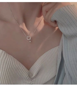 Detail view of S925 sterling silver planet necklace with CZ circle and star pendant
