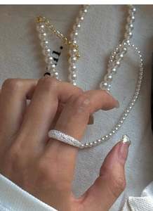 Close-up of S925 sterling silver frosted ring with stardust finish worn on a finger