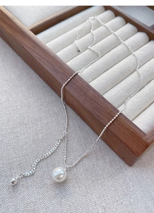 Detailed view of S925 sterling silver pearl necklace with delicate beaded chain design