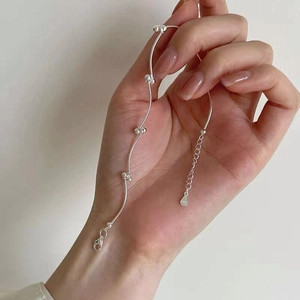 Elegant S925 sterling silver bean knot wave bracelet featuring small silver beads on a wavy chain