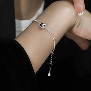 Elegant S925 sterling silver beaded bracelet with minimalist round ball on model's wrist