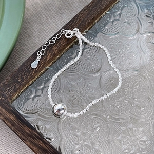 Minimalist S925 sterling silver beaded bracelet with sparkling cut chain on glass