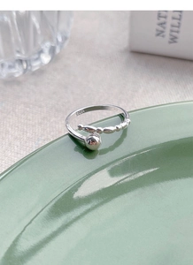 Macro view of polished S925 sterling silver beaded open ring with hallmark engraving