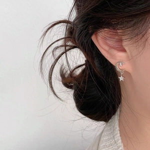 Elegant S925 sterling silver star and moon drop earrings with zircon on female model