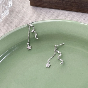 S925 sterling silver spinning star drop earrings with chains in a stylish display