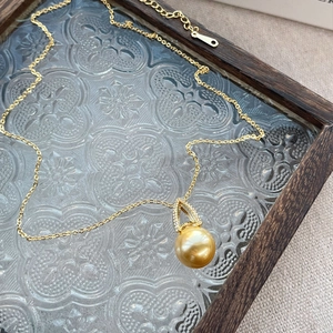 Elegant gold-plated S925 sterling silver necklace with a round faux pearl pendant